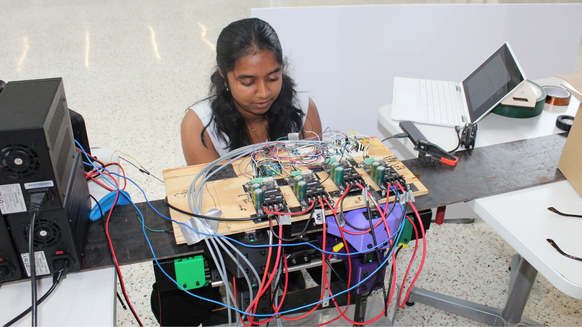 Teammate Neha Ramachandran working on the levitation test rig